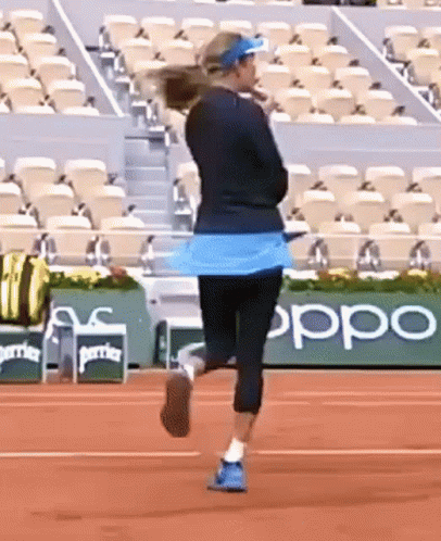 Woman Running on Tennis Court