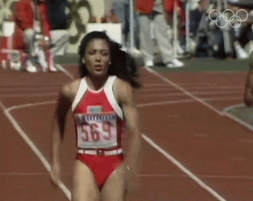 Woman Running On Track Number 563 GIF