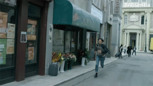 Woman Running with #absentia Sign