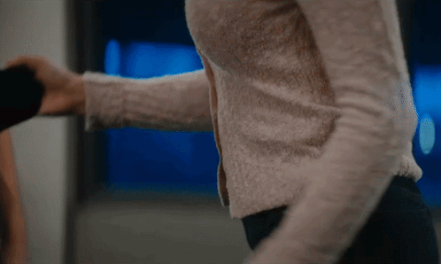 Woman's Arm Held by Man