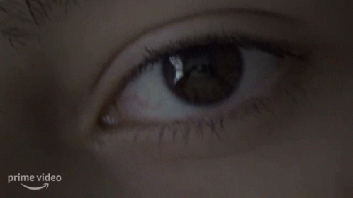 Woman's Eye With Arrow Pointing To Prime Video Logo GIF