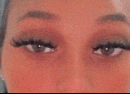 Woman's Eyes With Long Eyelashes and Red Cheeks