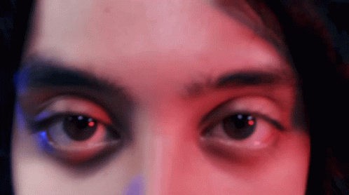 Woman's Eyes With Red and Blue Lights