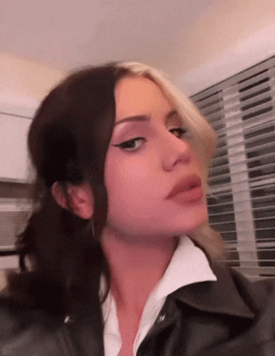 Woman's Face Close Up Leather Jacket GIF