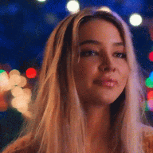 Woman's Face Close Up with Christmas Lights