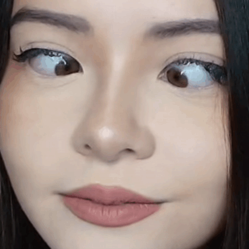 Woman's Face Close Up With Slight Smile