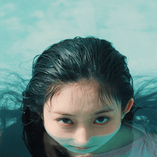 Woman's Face in Swimming Pool