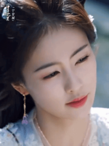 Woman's Face With Chinese Writing GIF