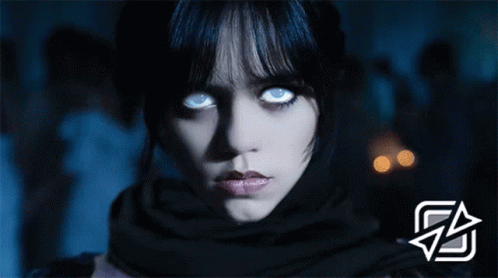 Woman's Face With Glowing Blue Eyes