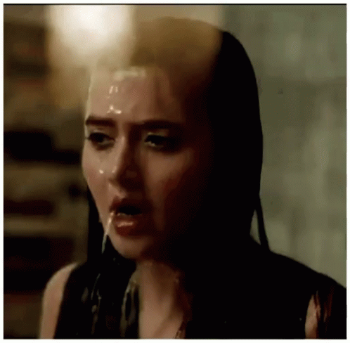 Woman's Face With Liquid On It