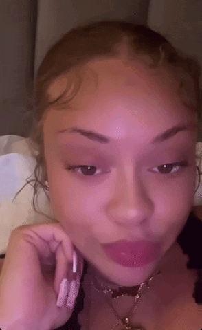 Woman's Face With Pink Background GIF
