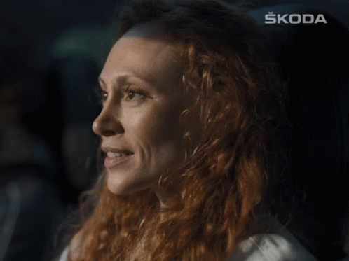Woman's Face With Skoda Behind GIF