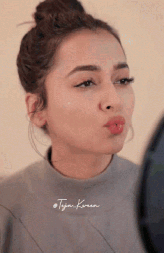 Woman's Face With Tyga Text GIF
