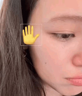 Woman's Face with Yellow Hand