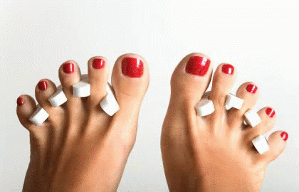 Woman's Feet with Red Toenails