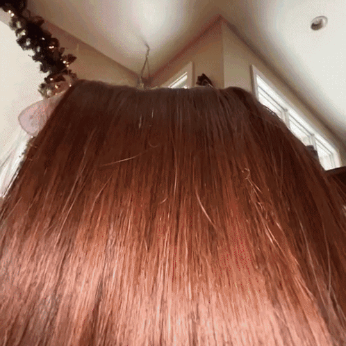 Woman's Hair Close Up With Christmas Tree