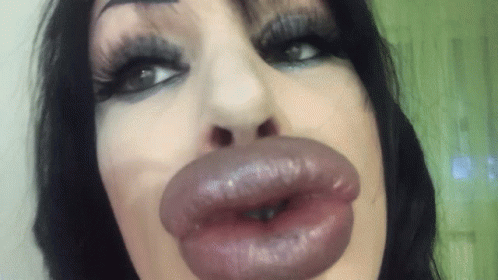 Woman's Lips Close Up Green Background