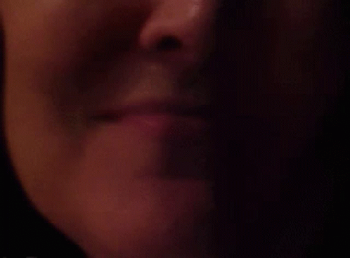 Woman's Lips In The Dark GIF
