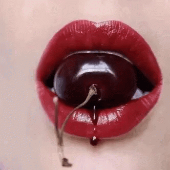 Woman's Lips With Cherry