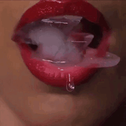 Woman's Mouth With Ice Cubes and Droplet