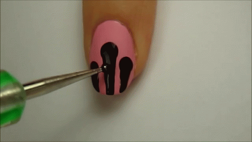 Woman's Nails Painted Pink Black and Green Tip