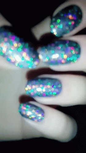 Woman's Nails With Blue And Green Glitter GIF