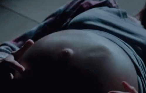Woman's Pregnant Belly Gets Kicked By Baby Inside GIF