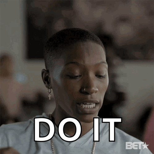 Woman Saying Do It Wearing Earrings and Necklace