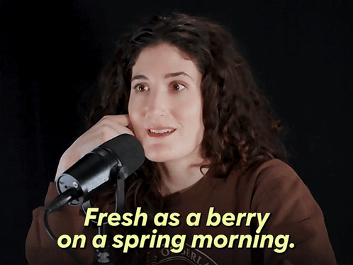 Woman Saying Fresh as a Berry Into Microphone