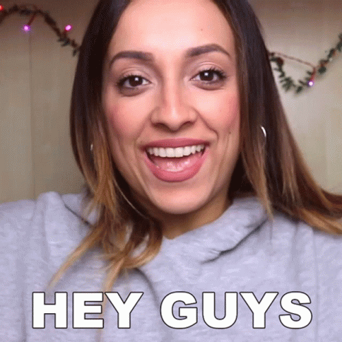 Woman Saying Hey Guys Smiling