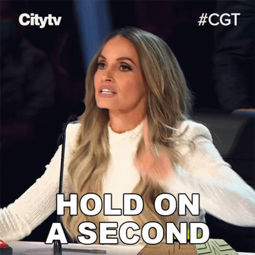 Woman Saying Hold On a Second at Microphone