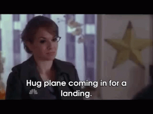 Woman Saying Hug Plane Coming In for a Landing