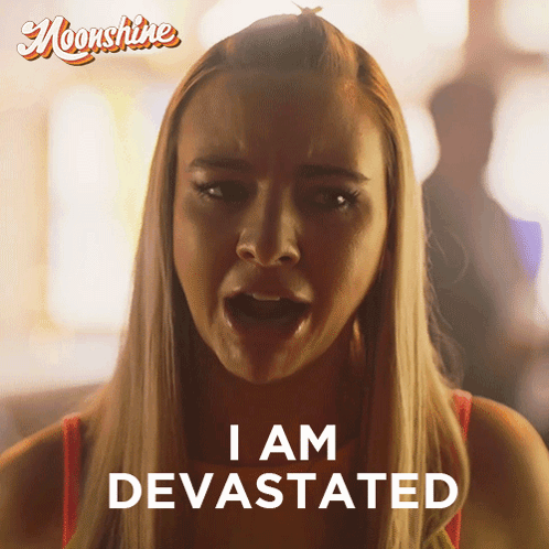 Woman Saying I Am Devastated in Front of Moonshine Ad