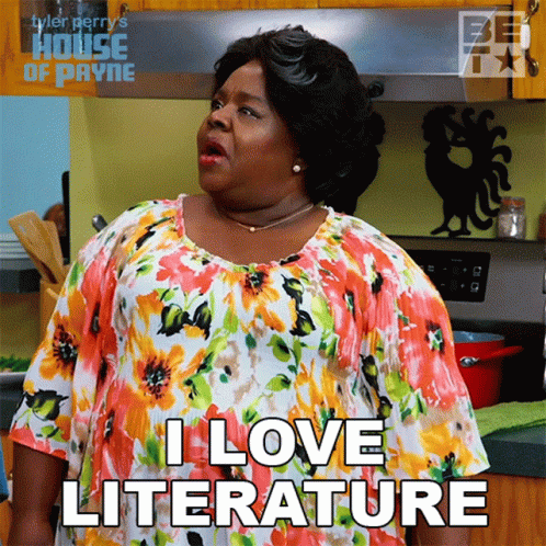 Woman Saying I Love Literature in Kitchen
