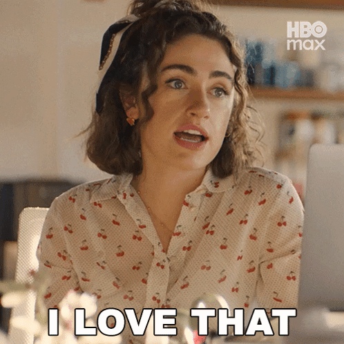 Woman Saying I Love That While Looking at Laptop