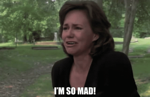 Woman Saying I'm So Mad In Front of Graveyard