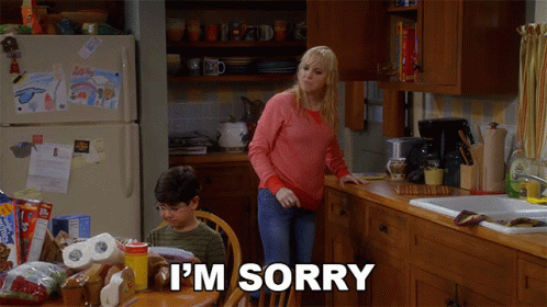 Woman Saying I'm Sorry to Boy at Table