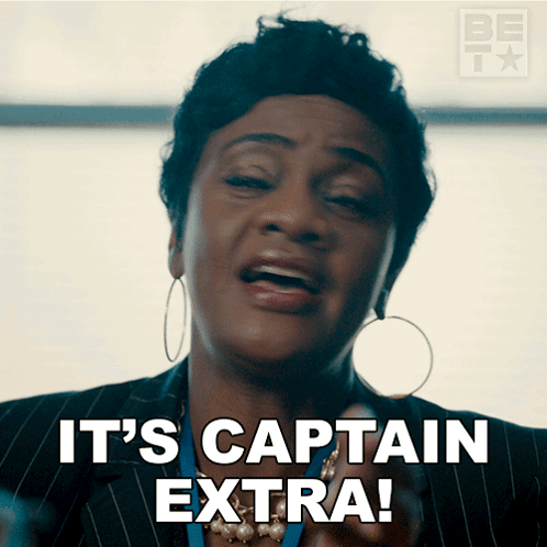 Woman Saying It's Captain Extra With Hoop Earrings