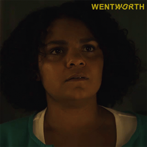 Woman Saying Knows What in Front of Wentworth Logo