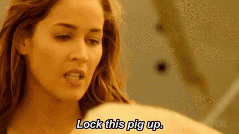 Woman Saying Lock This Pig Up Holding Pig