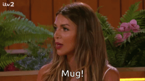Woman Saying Mug Among Flowers GIF