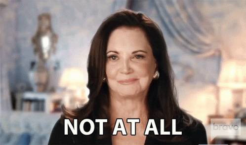 Woman Saying Not At All Smiling GIF