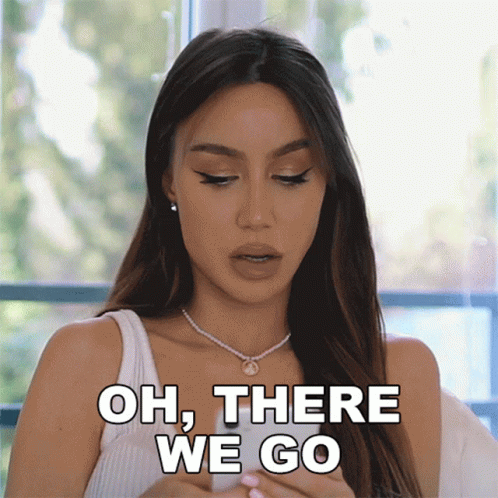 Woman Saying Oh There We Go in White Tank Top