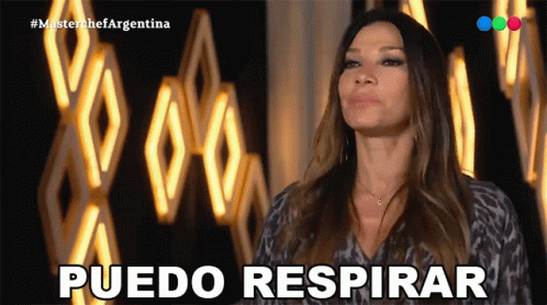 Woman Saying Puedo Respirar At Wall Of Lights GIF