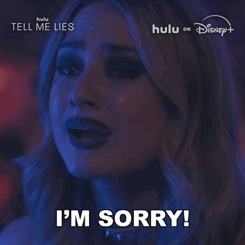 Woman Saying Sorry in Front of Hulu Disney Plus Sign