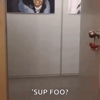 Woman Saying Sup Foo in Hallway