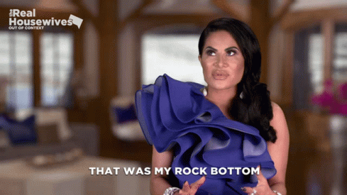 Woman Saying That Was My Rock Bottom in Blue Dress
