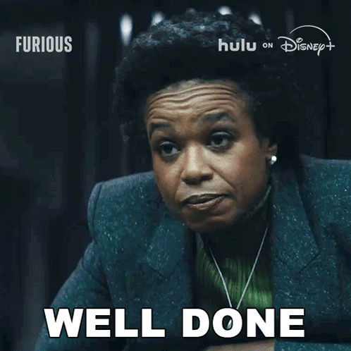 Woman Saying Well Done in Front of Disney Poster