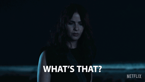 Woman Saying What's That In Dark Room