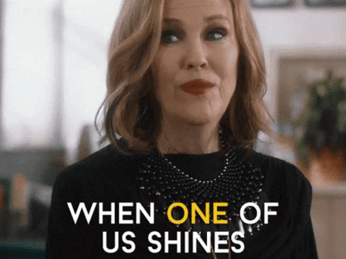 Woman Saying When One Shines In Black Top GIF
